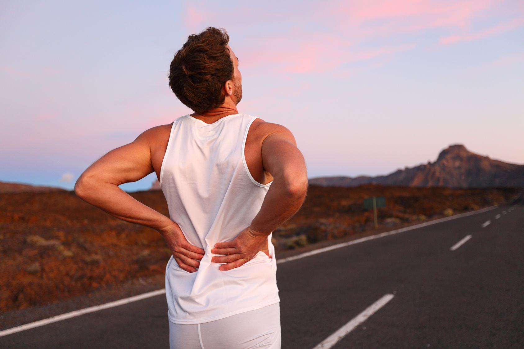Back pain - Athletic running man with injury